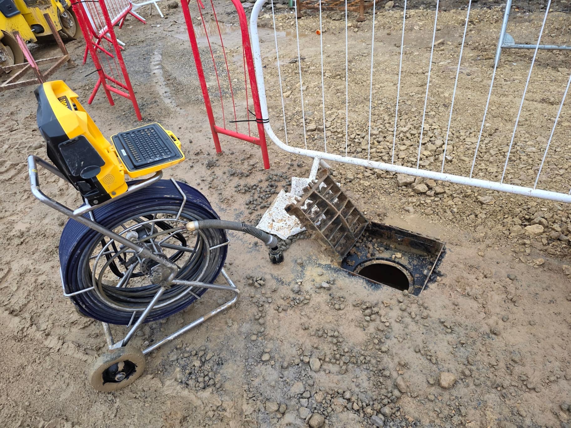 Active Reactive Solutions push-rod CCTV camera reel and control monitor at an open inspection chamber